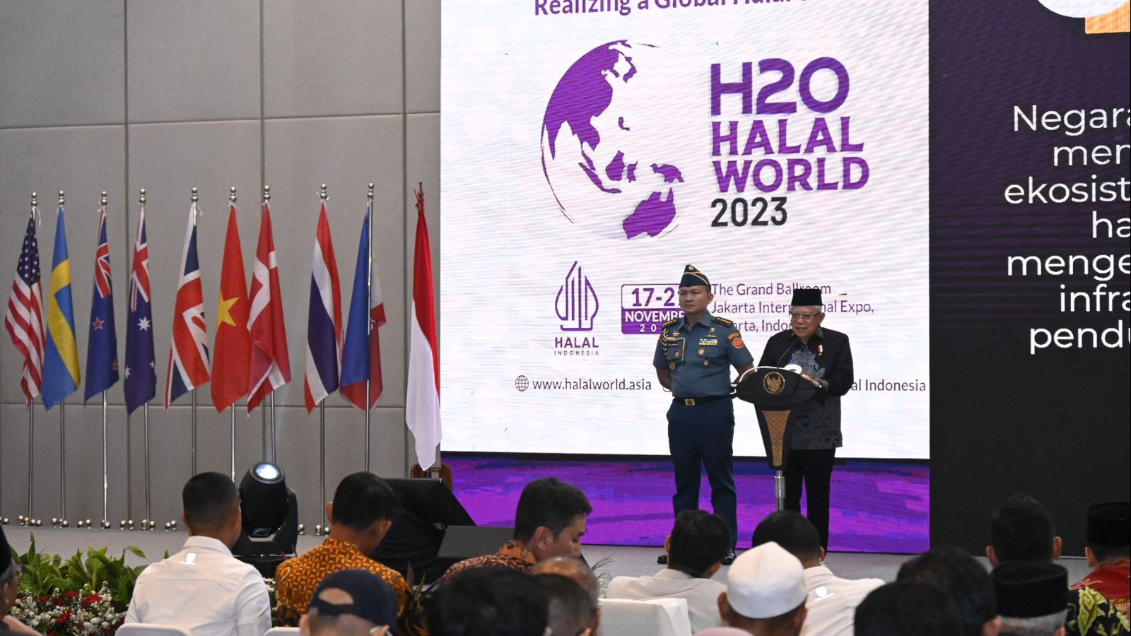 Large conference hall with stage and audience